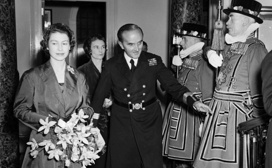 Queen Elizabeth II holding a bouquet of flowers as Captain G Curteis, Deputy Master of Trinity House, introduces her to the Yeoman of the Guard as they tour the rebuilt Trinity House on Tower Hill, 21 October 1953. Reg Speller/Fox Photos/Getty Images Queen Elizabeth II holding a bouquet of flowers as Captain G Curteis, Deputy Master of Trinity House, introduces her to the Yeoman of the Guard as they tour the rebuilt Trinity House on Tower Hill, 21 October 1953. Reg Speller/Fox Photos/Getty Images