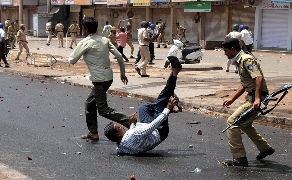 The police takes out a lathi charge on members of the Patidar community during their The police takes out a lathi charge on members of the Patidar community during their