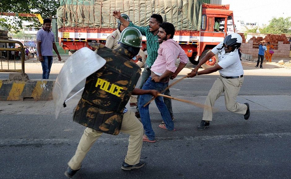 Police beat up the garment workers who were protesting. Faced with violent opposition, the government put on hold the new rules. PTI Police beat up the garment workers who were protesting. Faced with violent opposition, the government put on hold the new rules. PTI