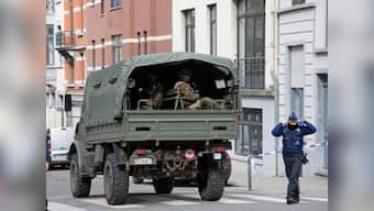 Paris attacks suspect Mohamed Abrini arrested in Brussels as accomplice Salah Abdeslam awaits extradition to France