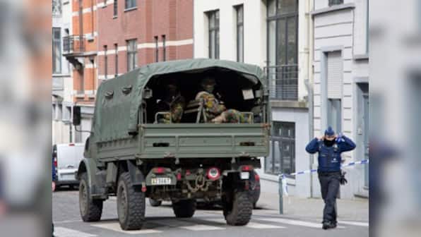 Belgium charges two men for Brussels attacks, detains three others for Paris attacks