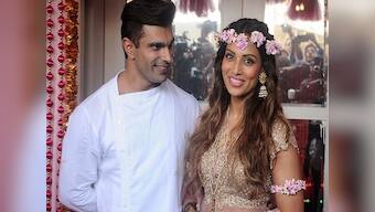 The bride wore pink: Bipasha Basu is radiant at 'mehendi' as groom-to-be Karan Singh Grover looks on