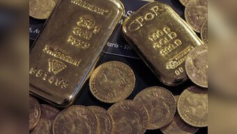 Gold prices ease from 4-week high as dollar, equities strengthen on signs of coronavirus slowdown