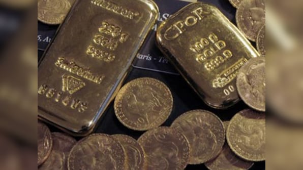 Gold prices ease from 4-week high as dollar, equities strengthen on signs of coronavirus slowdown