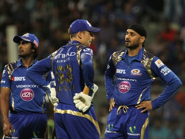 Mumbai Indians player Harbhajan Singh speaks with Jos Buttler during their match against Rising Pune Supergiants. Sportzpics