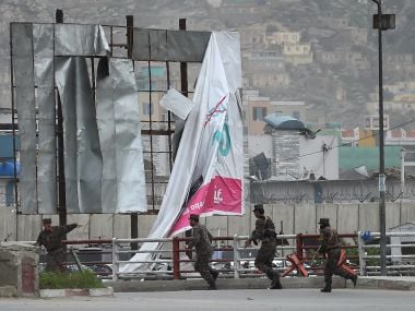 Afghanistan security personnel arrive at the site of the blast in Kabul on Tuesday. AFP