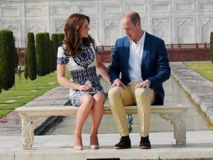 Britain's Prince William, along with his wife, Kate, the Duchess of Cambridge, pose in front of the Taj Mahal in Agra on Saturday. PTI