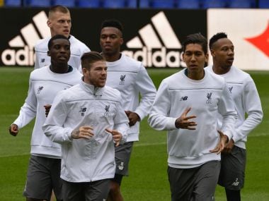 Liverpool's players run during a training session at the Madrigal Stadium in Villareal.