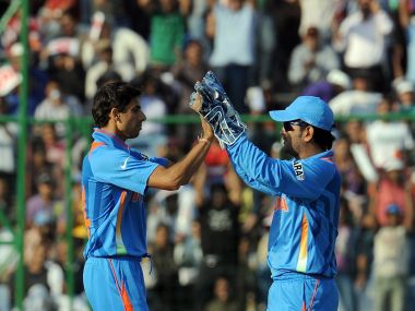 Ashish Nehra and MS Dhoni. AFP