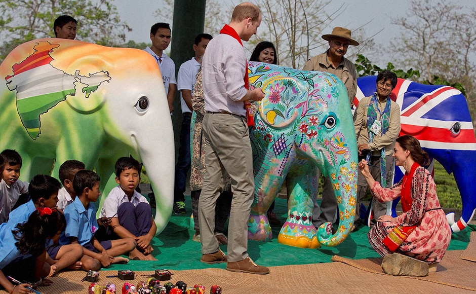 Kate gives a finishing touch of paint to a statue as Prince William looks on, at the CWRC at Panbari reserve forest. PTI Photo Kate gives a finishing touch of paint to a statue as Prince William looks on, at the CWRC at Panbari reserve forest. PTI Photo