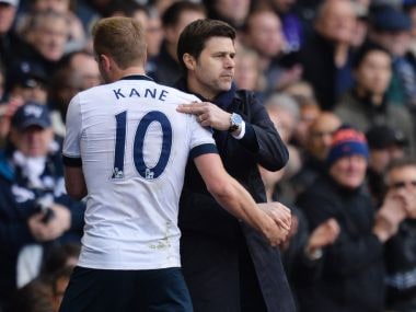 Tottenham Hotspur's head coach Mauricio Pochettino embraces Harry Kane after he is substituted. AFP