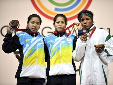 File picture of Mirabai Chanu Saikhom (L) and Sanjita Chanu Khumukcham (C). AFP