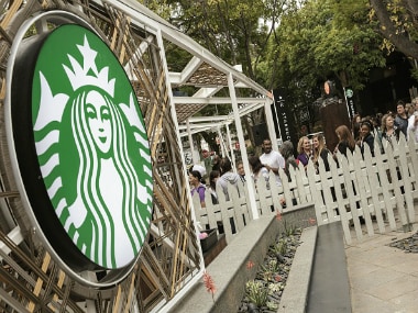 Hundreds of people queue during the official opening of South Africa's first Starbucks store, also the US coffeehouse chain's first store in Sub-Saharan Africa. Getty Images