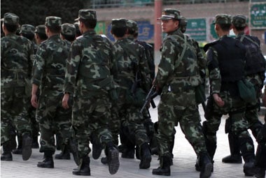 File photo of armed troops in the restive Uyghur region. Reuters