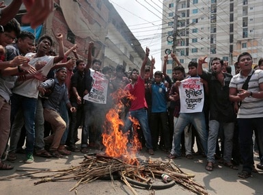 Bangladeshi students protest the killing of activist Nazimuddin Samad. Islamist groups have been involved in a spate of attacks on secularists in Bangladesh. AP