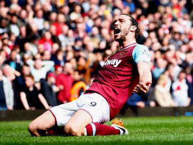 Andy Carroll struck an 8-minute hat-trick to dent Arsenal's title hopes. Getty