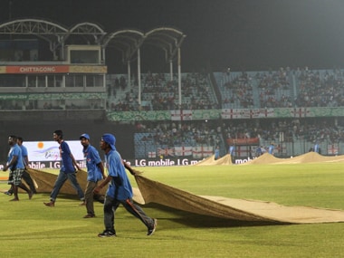Ground staff wipe the dew from the grounds during a ICC World Twenty20 match. Getty Images