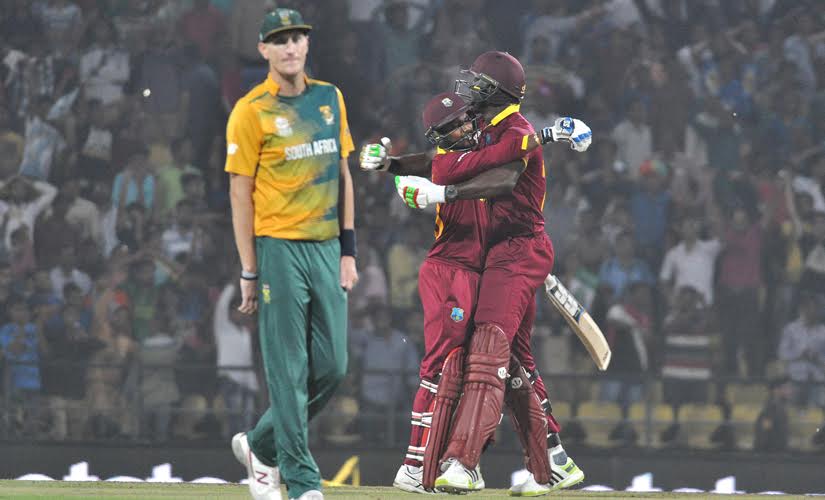 Carlos Brathwaite and Denesh Ramdin celebrate after winning against South Africa. Solaris Images