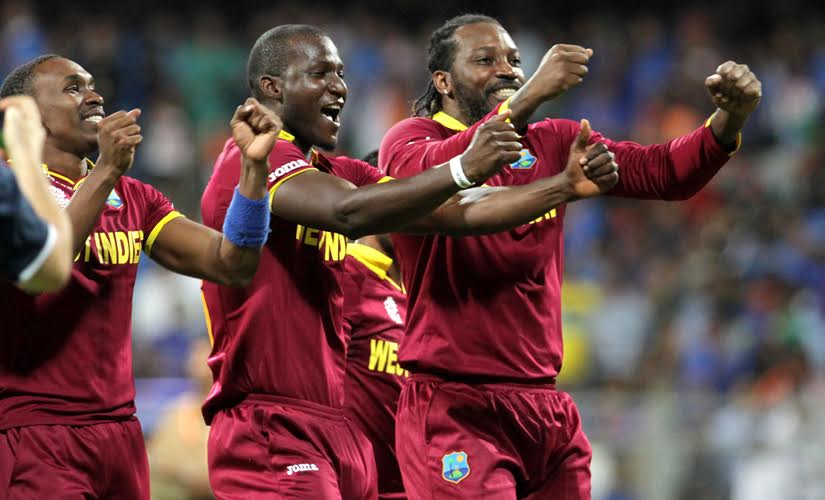 Dwayne Bravo, Darren Sammy and Chris Gayle celebrate after West Indies beat India by 7 wickets in the semi-final. Solaris Images