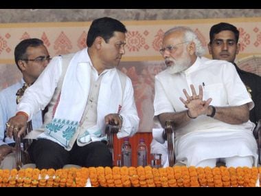 Prime Minister Narendra Modi with the newly sworn-in Assam Chief Minister Sarbananda Sonowal on Tuesday. PTI
