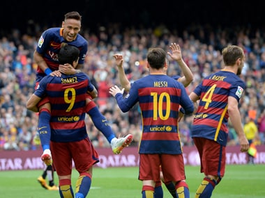 Barcelona's Luis Suarez celebrates with Neymar and teammates. AFP