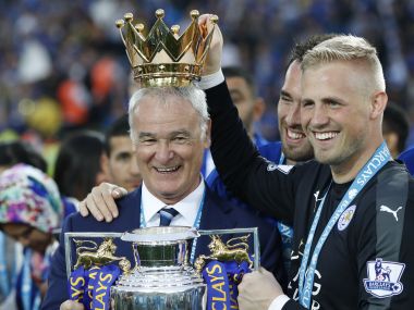 Leicester City's manager Claudio Ranieri poses with the Premier League trophy. AFP