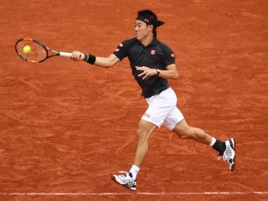 Kei Nishikori of Japan hits a forehand in action at the French Open. Getty
