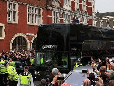 A drink can hits the screen of the Manchester United team bus as it arrives for the English Premier League soccer match against West Ham United at Upton Park. AP