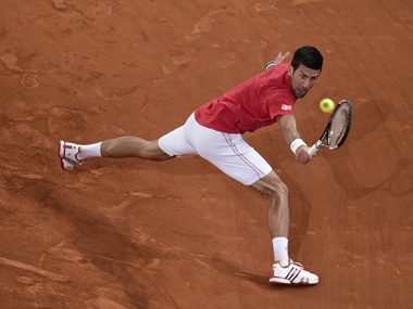 Novak Djokovic returns a ball Milos Raonic during the Madrid Open. AFP