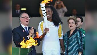 Rio 2016: Olympic flame arrives in crisis-hit Brazil for symbolic handover
