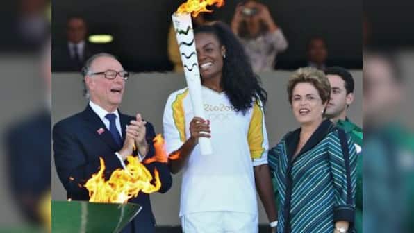 Rio 2016: Olympic flame arrives in crisis-hit Brazil for symbolic handover
