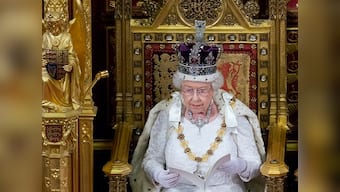 Queen Elizabeth II outlines UK government's agenda in scaled-down speech  in Parliament