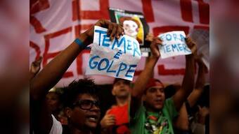 Thousands swarm streets against acting president in Brazil