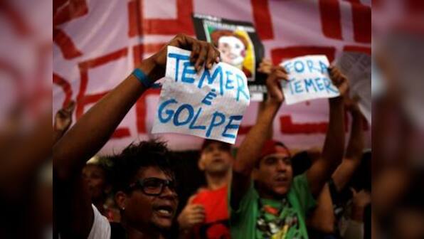 Thousands swarm streets against acting president in Brazil