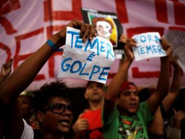 Thousands swarm streets against acting president in Brazil