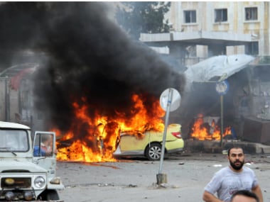 Site where the suicide bombers blew themselves followed by a car bomb in a parking lot packed during morning rush hour in Tarcus on Monday. AP