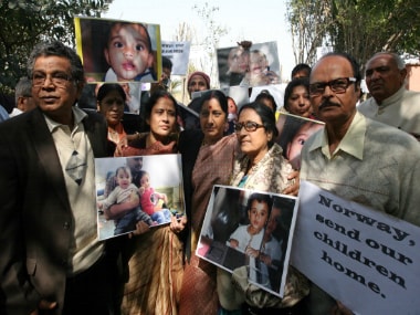 Sushma Swaraj protest with grandparents of NRI children Aishwarya and Abhigyan during a protest demanding their return from Norway, outside the Norwegian Embassy in New Delhi. Getty Images