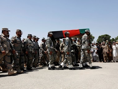 Afghan security forces carry the coffin of an Afghan soldier, who was killed last night during gun fighting between Afghan border forces and Pakistani forces in Torkham, during his funeral in Nangarhar province, Afghanistan province. Reuters