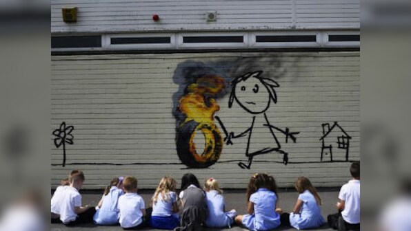 Banksy strikes again, gifts Bristol elementary school a mural