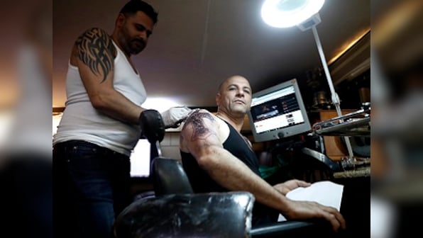 For Bethlehem tattoo artist Walid Ayash, religion is more than skin deep