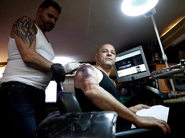 For Bethlehem tattoo artist Walid Ayash, religion is more than skin deep