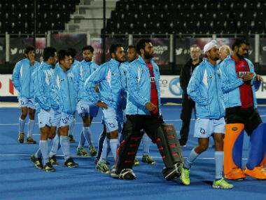 The Indian team walk round the pitch after lodging a protest concerning the penalty shoot out. AP