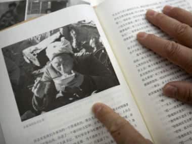 Wang kemin shows a photo of Gu. AP