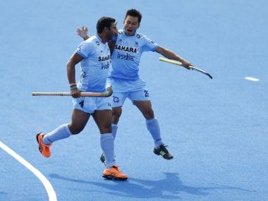 India's Raghunath Vokkaliga celebrates scoring the first goal during the Pool game between Germany and India. AP