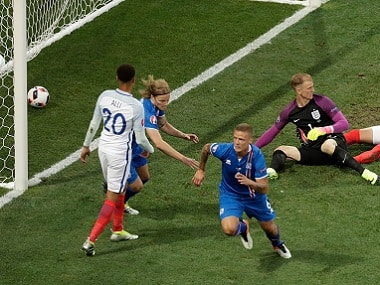 Iceland's Ragnar Sigurdsson (c) celebrates after scoring against England. AP