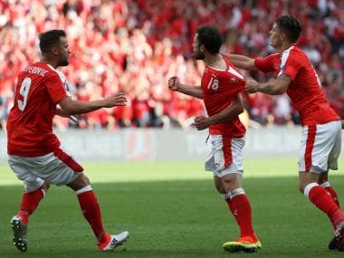 Mehmedi celebrates his goal with teammates. AFP