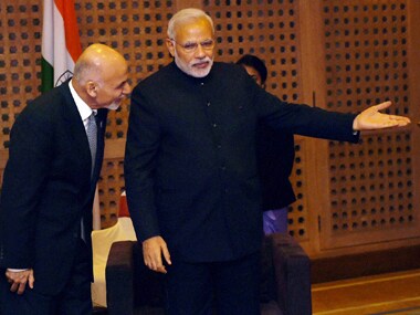 Prime Minister Narendra Modi with Afghanistan President Ashraf Ghani. PTI