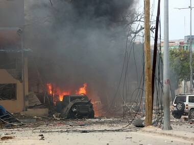 A vehicle burns at the scene of a suicide bomb attack outside Nasahablood hotel in Mogadishu. Reuters 