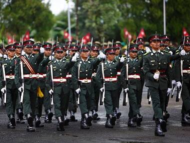 Former Maoist rebels take part in a parade after being integrated as lieutenants into the national army as part of the peace deal at Nepal Military Academy in Kharipati in Bhaktapur in 2013. This is the final step for the integration process of Maoist rebels into the national army. Reuters 
