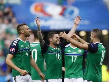 Northern Ireland's Gareth McAuley, Oliver Norwood and Aaron Hughes celebrate win over Ukraine. Reuters